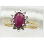 A 9ct gold ring set with a ruby surrounded by diamonds, 3.2g, size S
