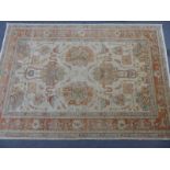 Beige ground rug with pink and blue decoration, 294 x 204cm