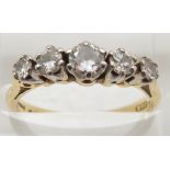 An 18ct gold ring set with five round cut diamonds, 3.1g, size L