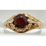 A 9ct gold ring set with a garnet, 2.1g, size J