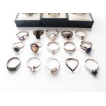 A collection of silver rings including pearl set, cameo, peridot, quartz etc