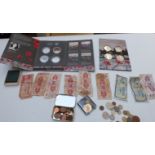 A group of collectors' coins including War Poppy Collection, Festival of Britain, banknotes, small
