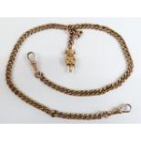 A 9ct gold watch chain/ Albert with a 15ct gold pixie charm, 14g, 36cm long