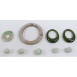 Two nephrite jade rings, jade discs, and jade beads