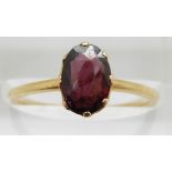 Victorian 9ct gold ring set with an oval cut almandine garnet, in original Piccadilly Circus box,
