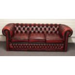 A red leather three seat Chesterfield sofa, length 206cm