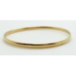 An 18ct gold bangle, 6.6g, 5.9 x 6cm