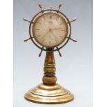 20thC Oris eight day brass novelty clock in the form of a ship's wheel, 20cm tall