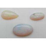 Two oval opal cabochons approx 2ct & 0.7ct and a pear cut cabochon approximately 1.5ct
