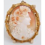 Victorian cameo pendant depicting a lady with flowers in her hair within a foliate border, 6cm long