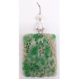 A large pierced Chinese jadeite plaque with a white metal pendant fitting set with a pearl, 5.5cm