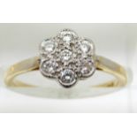 An 18ct gold ring set with diamonds in a platinum cluster, 2.8g, size L