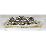 An 18ct gold ring set with diamonds in a platinum setting, 2.1g, size M