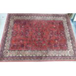 Red ground wool rug with beige border, 170 x 237cm