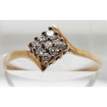 A 9ct gold ring set with diamonds, 1.3g, size Q