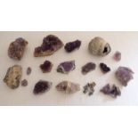 A collection of amethyst quartz part geodes and other mineral samples.