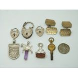 A pair of silver cufflinks, three silver padlocks, silver England pendant, silver pendant, watch key