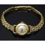 Omega 18ct gold ladies wristwatch ref. 10774 with gold hands and hour markers, champagne dial and