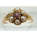 Victorian ring set with a garnet surrounded by seed pearls, 1.9g size O