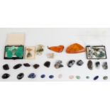 Forty various polished mineral samples and gemstones including amber, agate, quartz etc, some set in