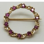 A 9ct gold brooch/ pendant set with rubies and diamonds, 2.1g