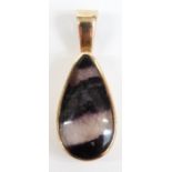 A 9ct gold pendant set with a pear cut fluorite cabochon, 4g