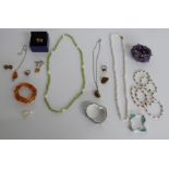 A collection of silver jewellery including rings, earrings set with pressed amber, amethyst