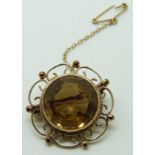 Victorian 9ct gold brooch set with a round cut citrine