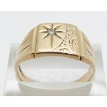 A 9ct gold signet ring set with a diamond in a star setting, 5.4g, size T