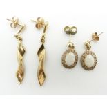 A pair of yellow metal earrings and a pair of 9ct gold earrings set with opals