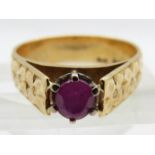An 18ct gold ring set with an oval cut ruby, 4.8g, size M