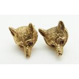 A pair of 9ct gold earrings in the form of fox's heads set with ruby eyes, 4.5g