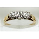 An 18ct gold ring set with three diamonds in a platinum setting, 2.2g, size K