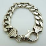 A silver curb link bracelet