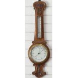 A carved oak aneroid barometer, 90cm tall