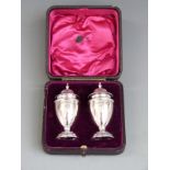 Cased pair of George V hallmarked silver peppers, Birmingham 1905 maker William Henry Sparrow,