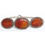 A silver bracelet set with Carnelian agate carved with script detail