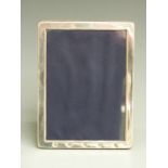 Millennium feature hallmarked silver photograph frame to suit 7x5 inch photo, with easel back