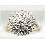A 9ct gold ring set with diamonds in a cluster, 2.6g, size L