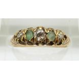 A 9ct gold ring set with emeralds and diamonds, 2.8g, size L