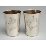 Pair of Russian white metal shot cups with 875 Russian silver marks and maker's name to base, height
