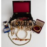 A collection of costume jewellery to include jet necklaces, Sarah Coventry bracelet, necklaces, a