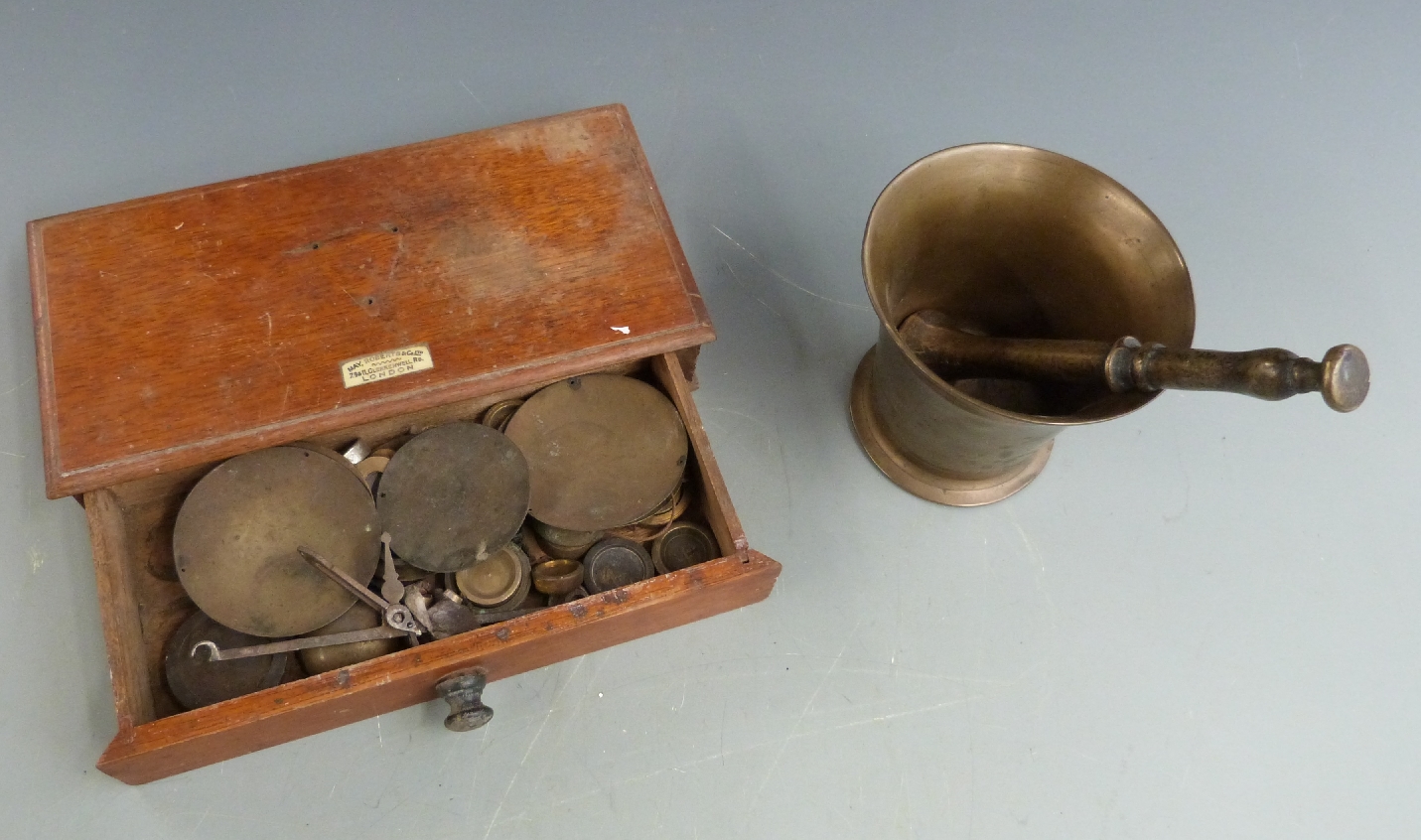 A set of weights and scales by May Roberts & Co, London, with box, together with a bronze pestle and - Image 2 of 2