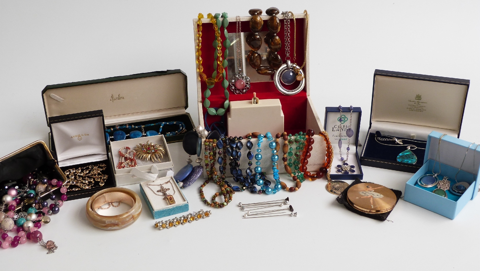 A collection of costume jewellery including a filigree brooch and necklace, two silver necklaces
