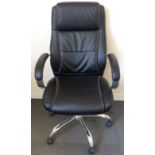 A leather office swivel chair raised on chrome base.