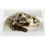 A 9ct gold ring in the form of a leopard set with sapphires and diamonds, 3.3g, size U