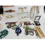 A collection of costume jewellery including Stratton compacts, Jewelcraft bracelet, brooches,