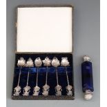 A 19thC / 20thC double ended scent bottle, the facet-cut blue glass bottle set with white metal