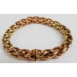 An 18ct gold plaited bracelet made up of rose and yellow gold sections, 33.7g