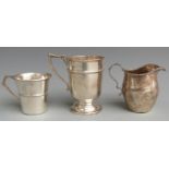 Two hallmarked silver mugs and a hallmarked silver jug, height of tallest 9.5cm, weight of all three